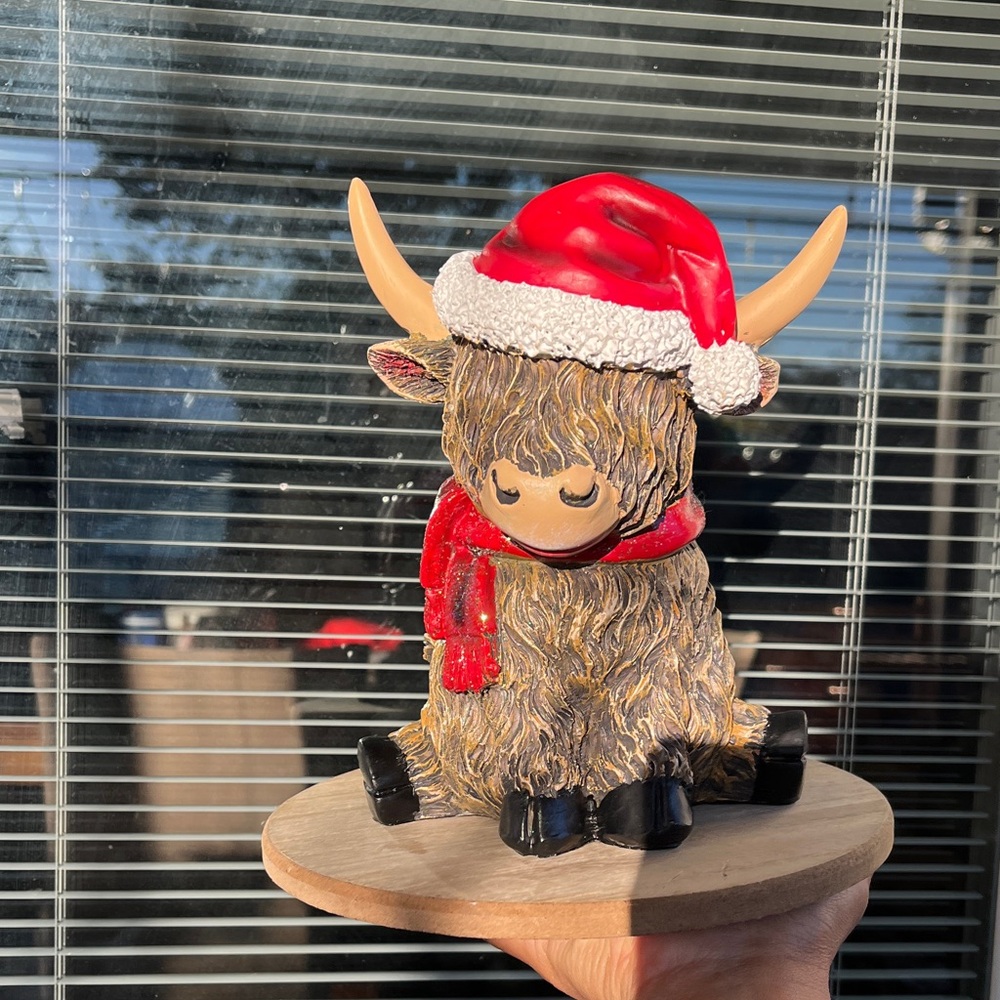 Festive Highland Cow Figurine with Red Santa Hat